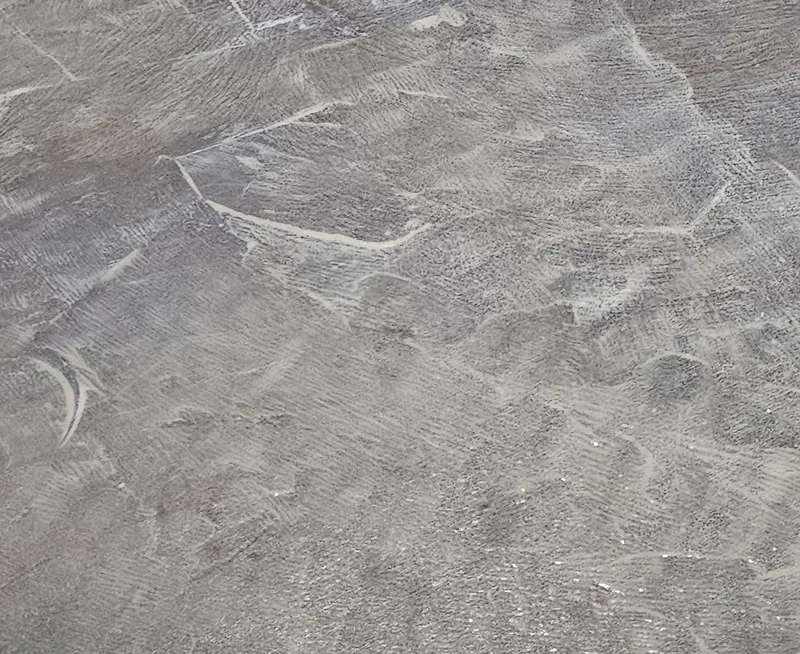 Prepared bathhouse concrete floor with visible mechanical preparation marks
